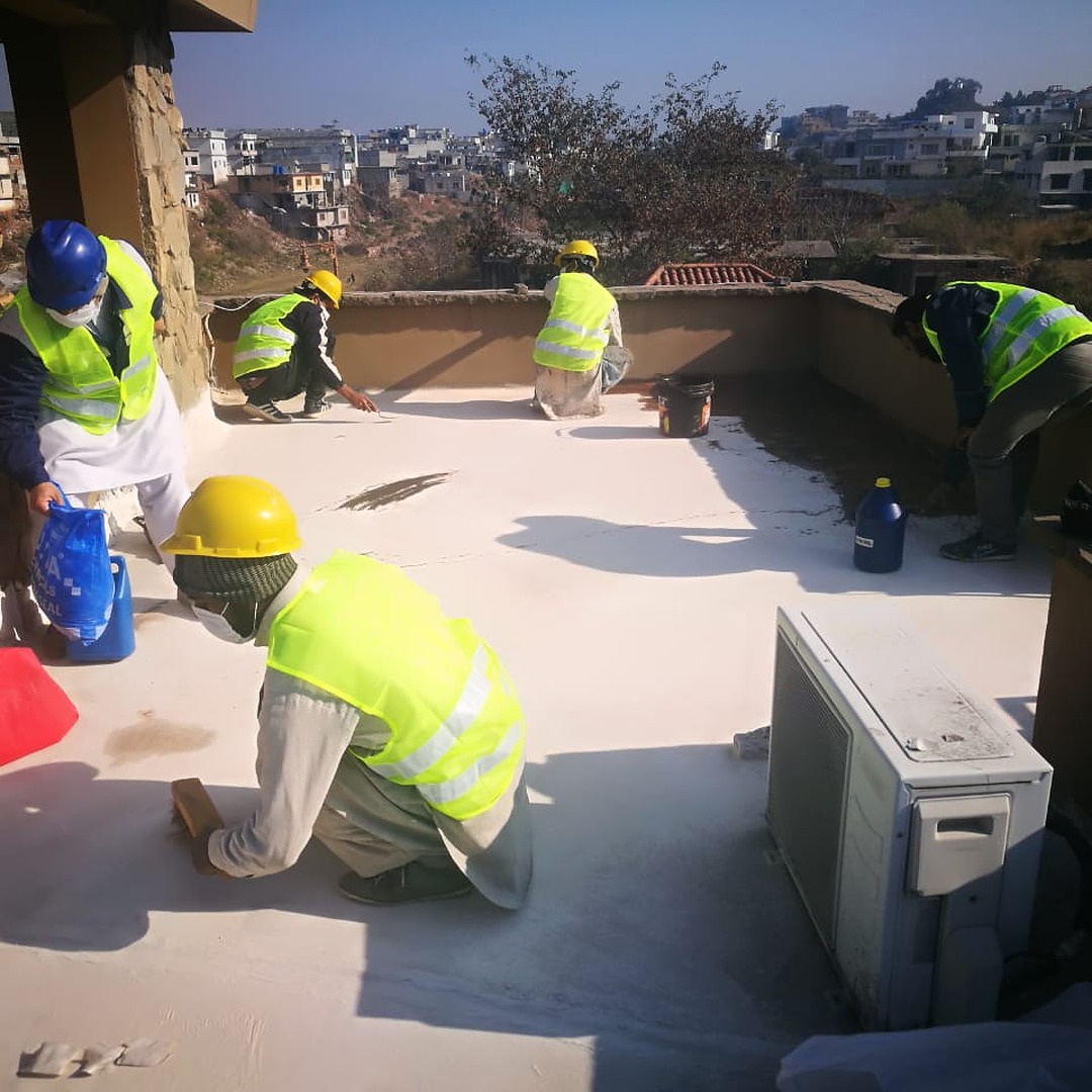 Masons working on roof top in Bani Gala, Islamabad