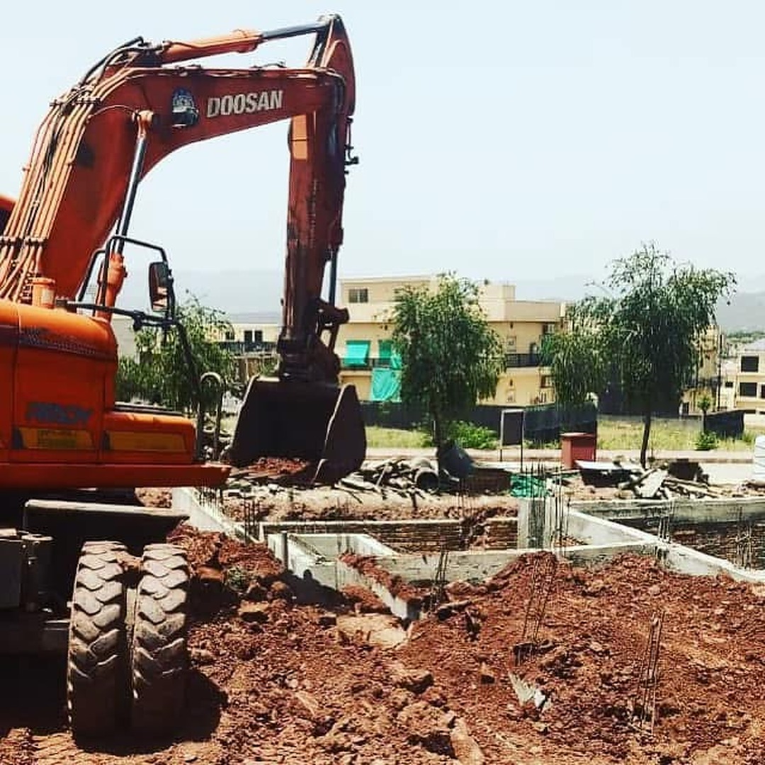 Excavator working at Construction Site in Bahria Enclave, Islamabad